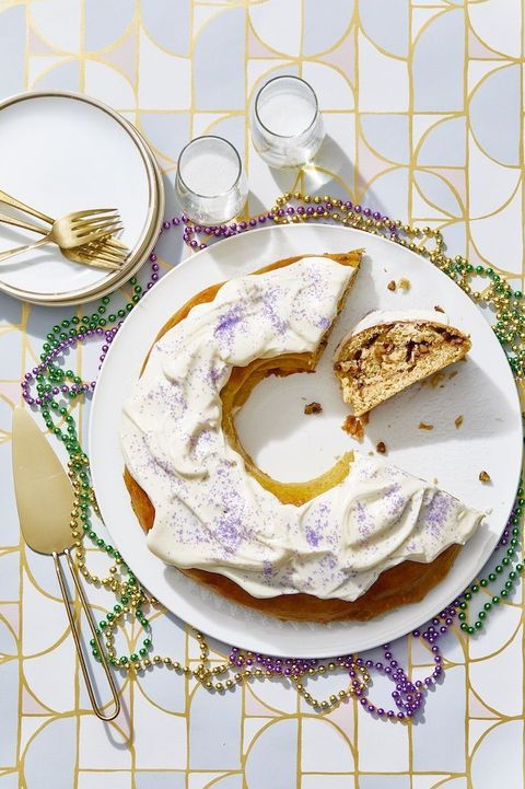 mardi gras king cake with purple sprinkles and white icing
