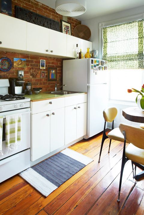 small kitchen with brick backsplash