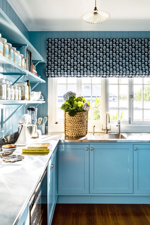blue kitchen with roman shades