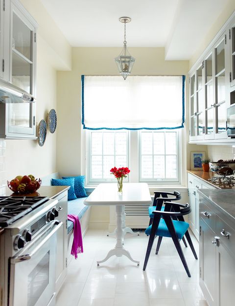 galley kitchen with blue and white breakfast nook