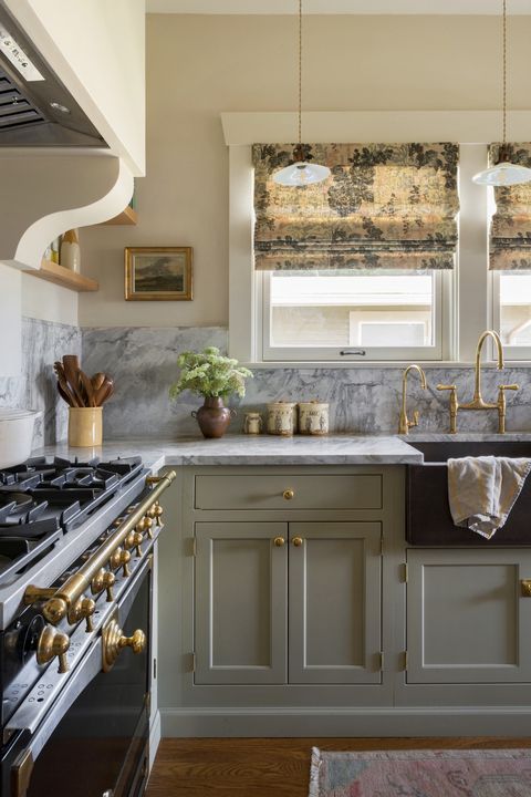 lauren lothrop caron studiolaloc in her own kitchen, the studio laloc founder added warm brass accents and roman shades in darby rose fabric by jasper to make the space more inviting
