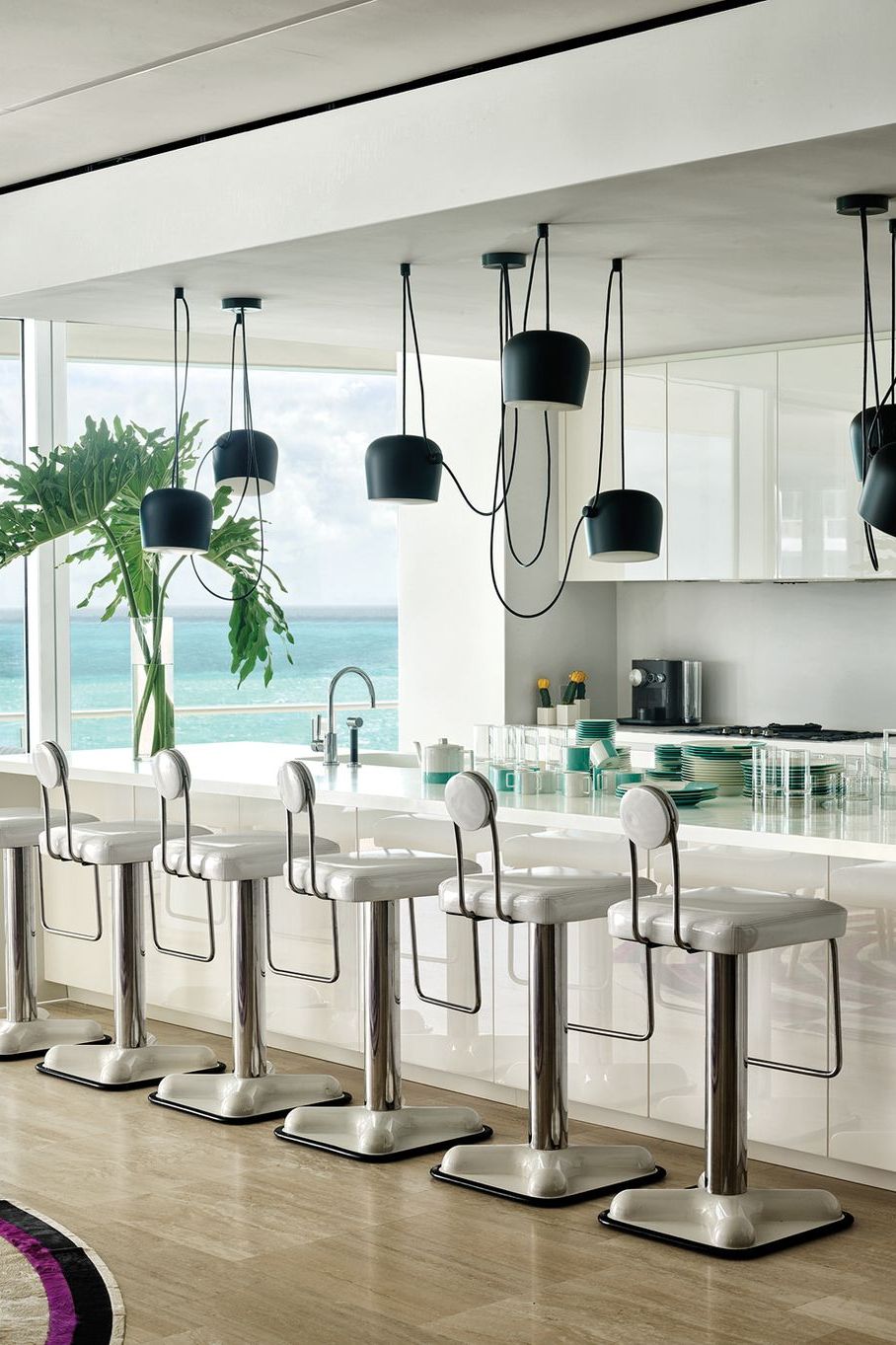 Featured image of post Modern Kitchen Lights Images - An ultra modern design coheres in this kitchen, featuring oblong island shape mirrored in the overhead lighting mount, standing apart in a strictly white cabinetry is mounted on far concrete wall.