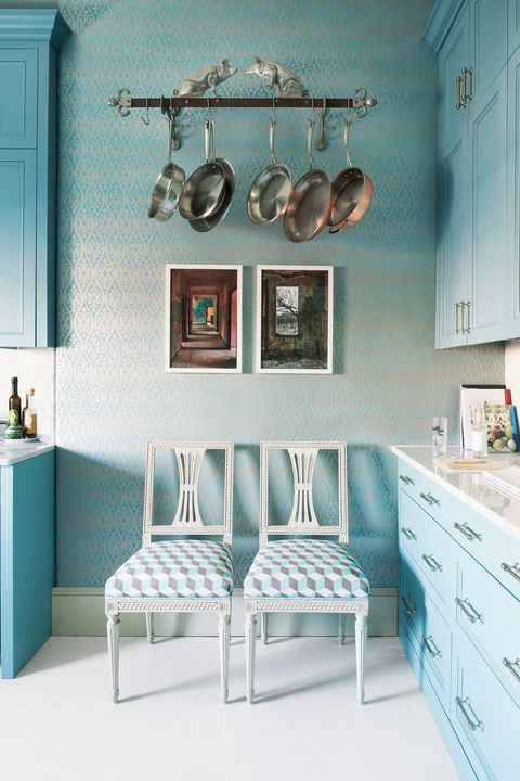 blue kitchen with hanging cookware