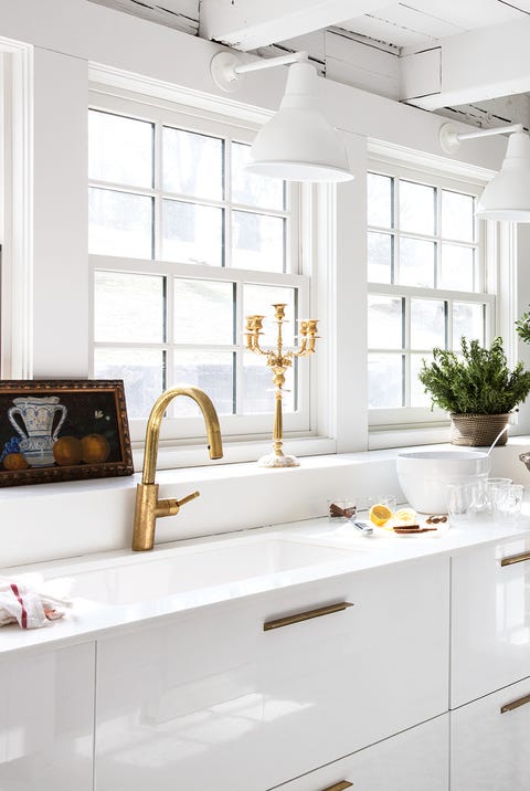 white kitchen with wall decor