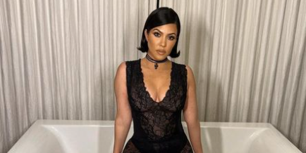 Kourtney Kardashian is rocking an unexpected 2010s accessory