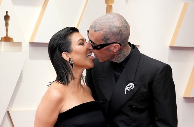 hollywood, california march 27 lr kourtney kardashian and travis barker attend the 94th annual academy awards at hollywood and highland on march 27, 2022 in hollywood, california photo by kevin mazurwireimage