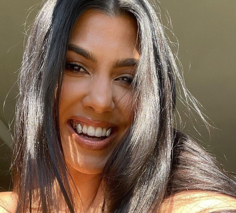 kourtney kardashian silver teeth fashion