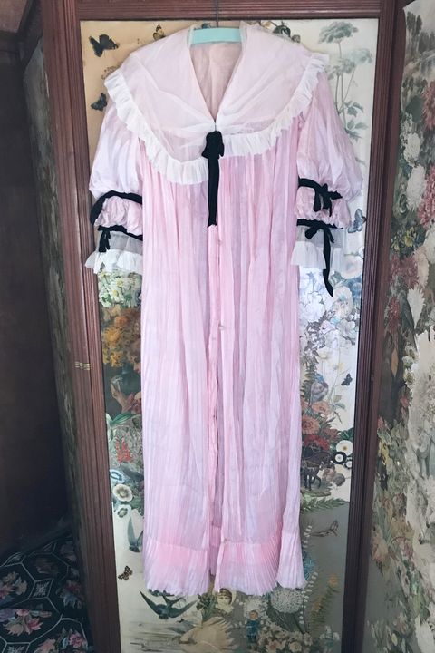 Clothing, Pink, Clothes hanger, Robe, Outerwear, Dress, Sleeve, Room, Textile, Peach, 