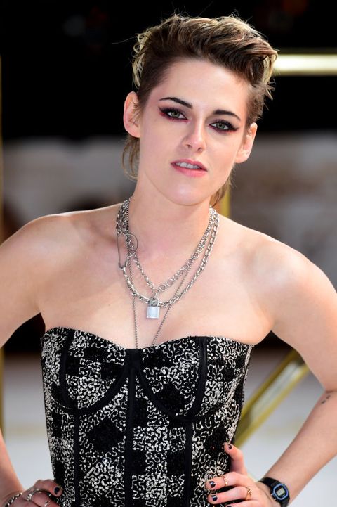 kristen stewart wears a black and silver checked dress on the red carpet