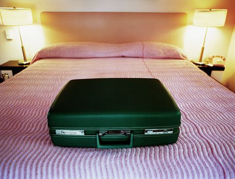 Suitcase on bed