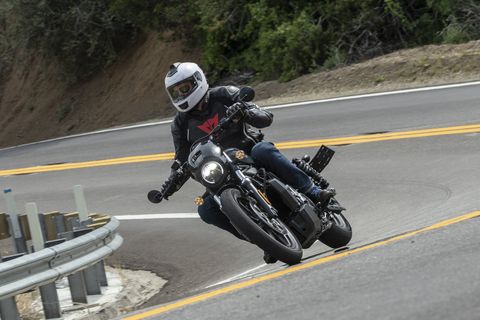 harley davidson nightster driving on a curvy mountain road