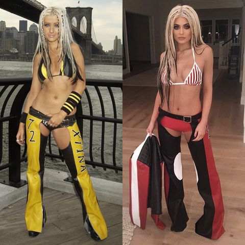 christina aguilera in yellow leather trousers and bikini top sliced with kylie jenner dressed in same outfit but in red
