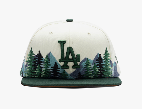an white hat with trees and the letter la on it