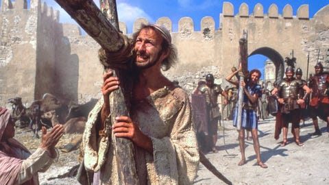 brian carrying the cross in the life of brian