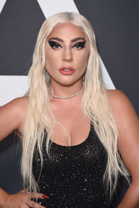 lady gaga wears a sparkly black tank dress and black eyeliner on the red carpet