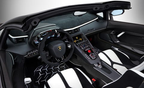 Land vehicle, Vehicle, Car, Steering wheel, Automotive design, Center console, Supercar, Sports car, Steering part, Design, 