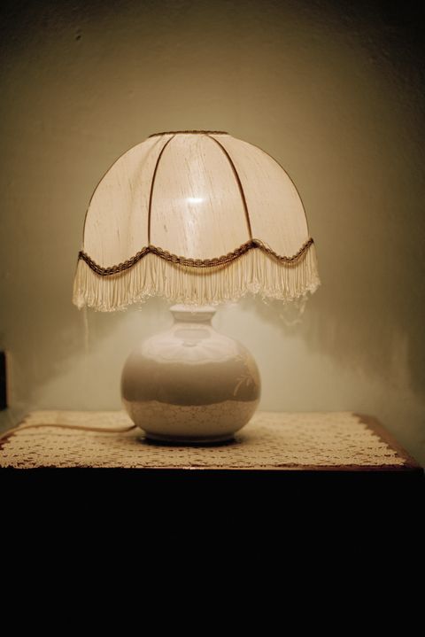 A lamp on a side table