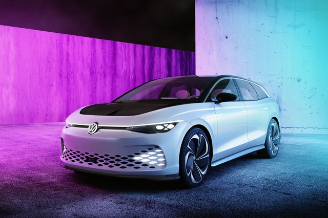 volkswagen id space vizzion concept parked in a concrete room with purple back lighting