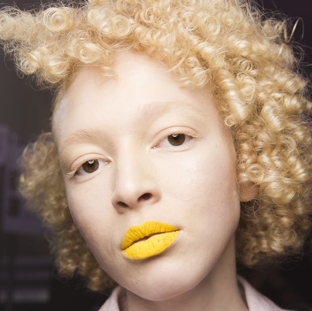 Hair, Face, Lip, Afro, Hairstyle, Jheri curl, Head, Yellow, Beauty, Nose, 