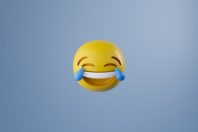 laughing face emoticon with big blue tears at eyes