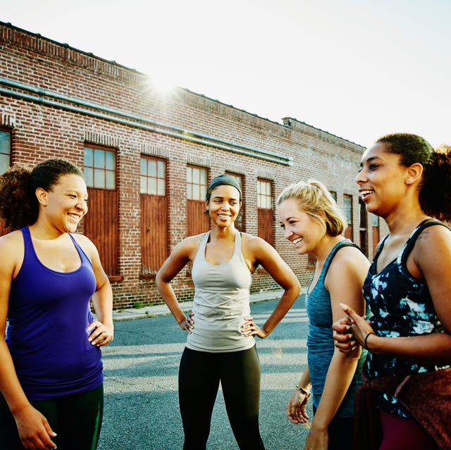 laughing group of women resting after run