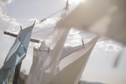 laundry hanging on clothesline in sunlight