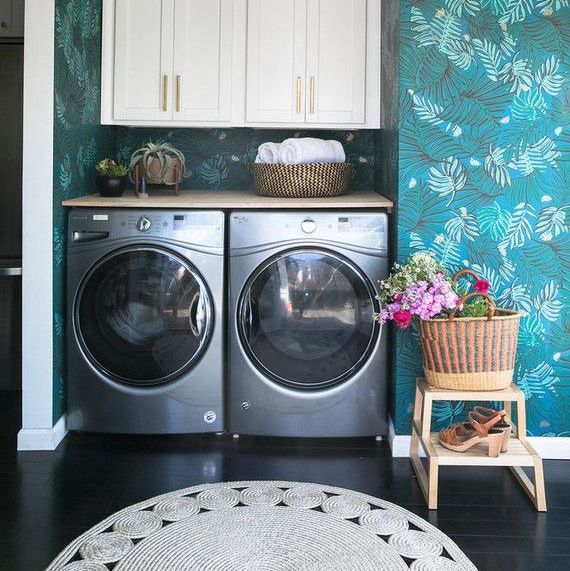 laundry room with botanical wallpaper