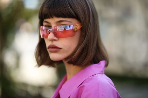 woman wearing pink glasses