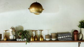 Shelf, Wall, Room, Furniture, Shelving, Interior design, Table, Still life photography, Light fixture, Lamp, 