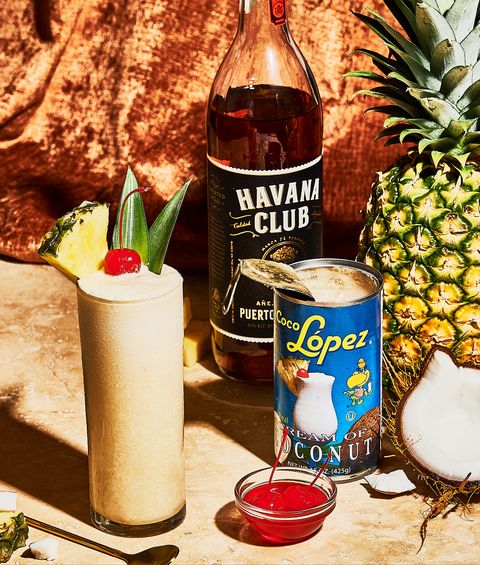 piña colada cocktail with rum, pineapple juice and coconut cream, and cherry to garnish