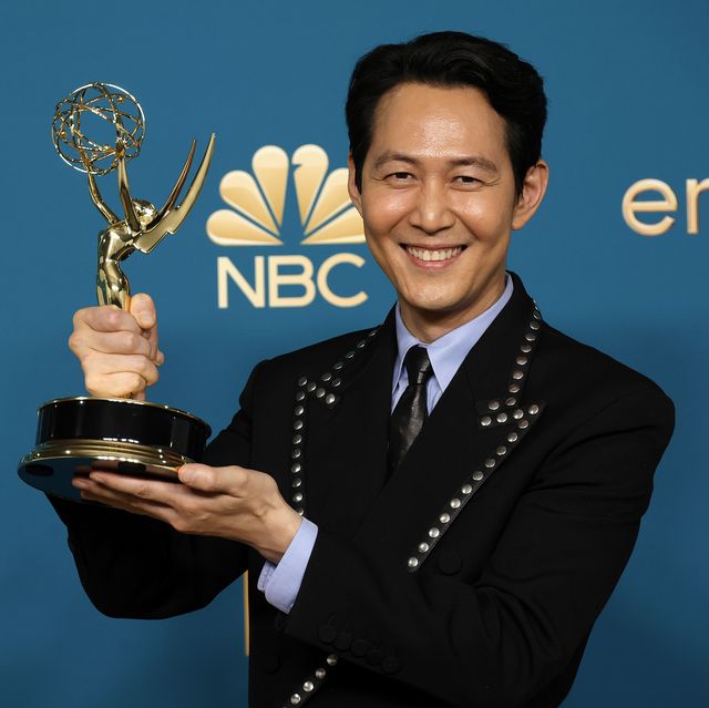 lee jung jae, star of squid game, holds his emmy backstage at the 2022 ceremony