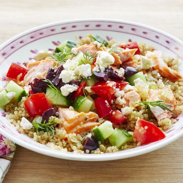 mediterranean salmon quinoa bowl with cucumbers and tomatoes