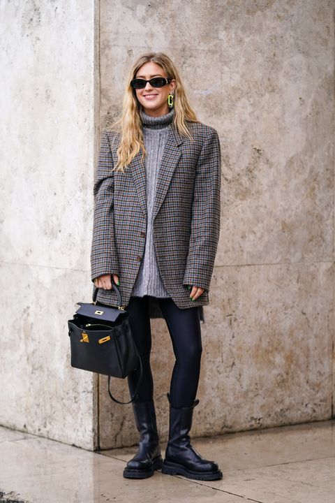 paris, france   march 02 emili sindlev wears sunglasses, earrings, a grey turtleneck, a grey houndstooth oversized jacket, black leggings, black mid calf boots, a black bag, outside akris, during paris fashion week   womenswear fallwinter 20202021, on march 02, 2020 in paris, france photo by edward berthelotgetty images