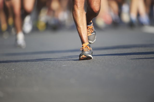 legs and feet of joggers, running a marathon