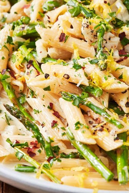 lemon asparagus penne pasta topped with parmesan and red pepper flakes