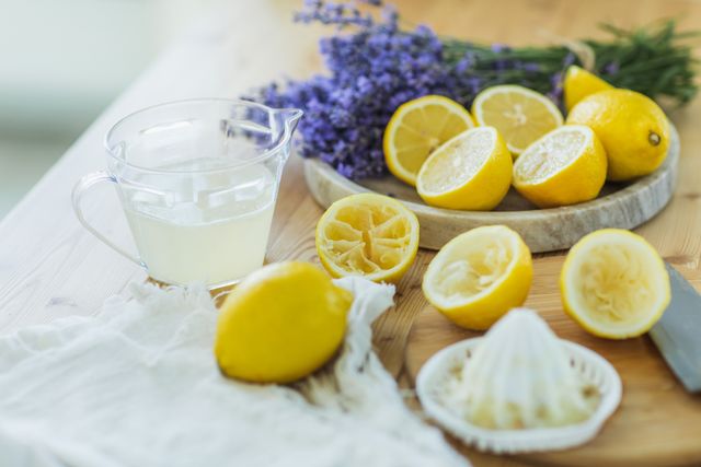 lemon squeezer and lemon juice on kitchen table