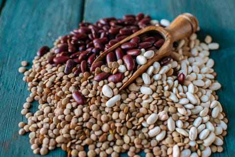 Lentils, red and white beans on blue wood Lentils, red and white beans on blue wood