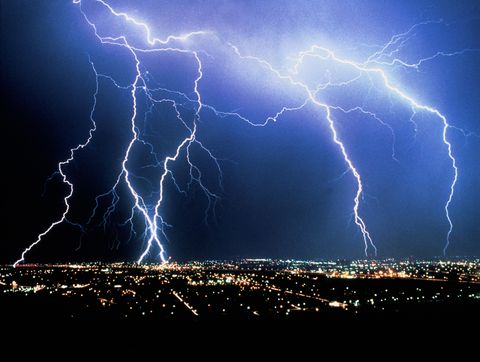 Lightning over cityscape at night