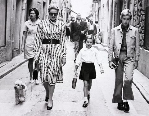 Princess Grace leads the children to school