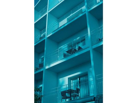 Teal, Turquoise, Facade, Aqua, Real estate, Apartment, Commercial building, Azure, Parallel, Balcony, 
