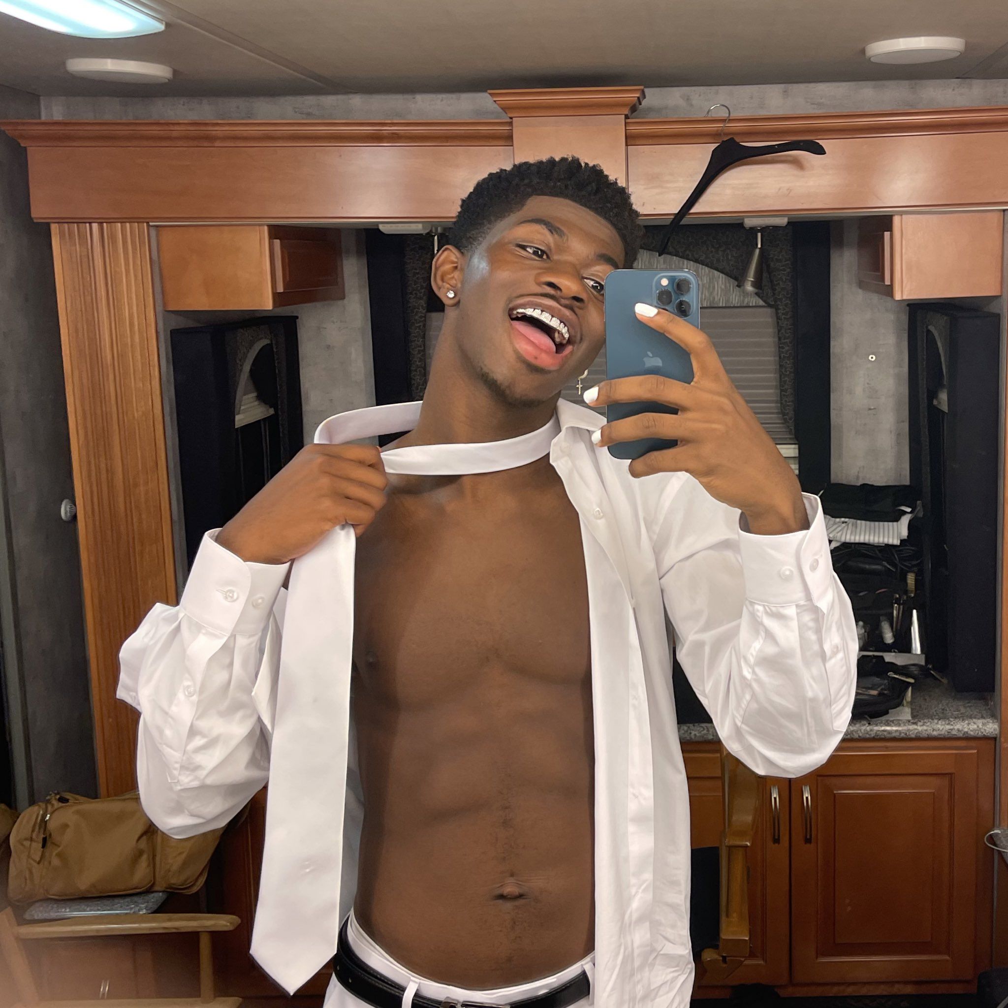 Lil Nas X teasing his abs (Image: menshealth.com)