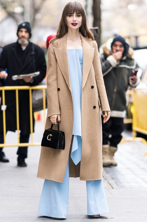 Lily Collins’ traditional camel coat