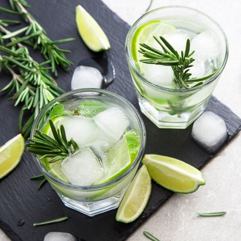 Lime Lemonade with rosemary and ice, selective focus
