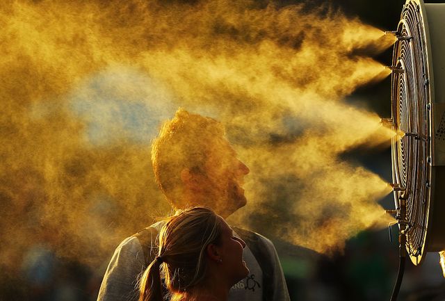 melbourne, australia   january 16  tennis fans cool off from the heat in front of mist cooling fans on day one of the 2017 australian open at melbourne park on january 16, 2017 in melbourne, australia  photo by scott barbourgetty images