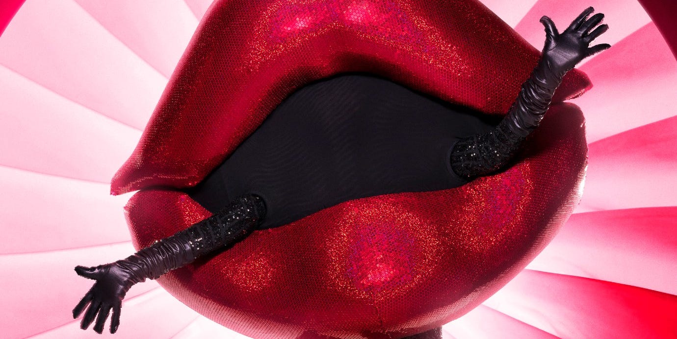 Here Are All the Theories About the Lips on The Masked Singer Here Are All the Theories About the Lips on The Masked Singer