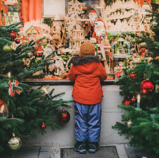 little boy  standing near christmas tree in rothenburg