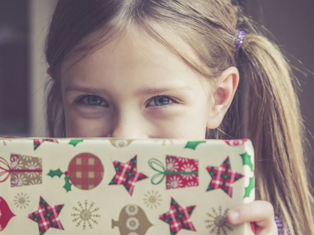 Little girl holding Christmas present