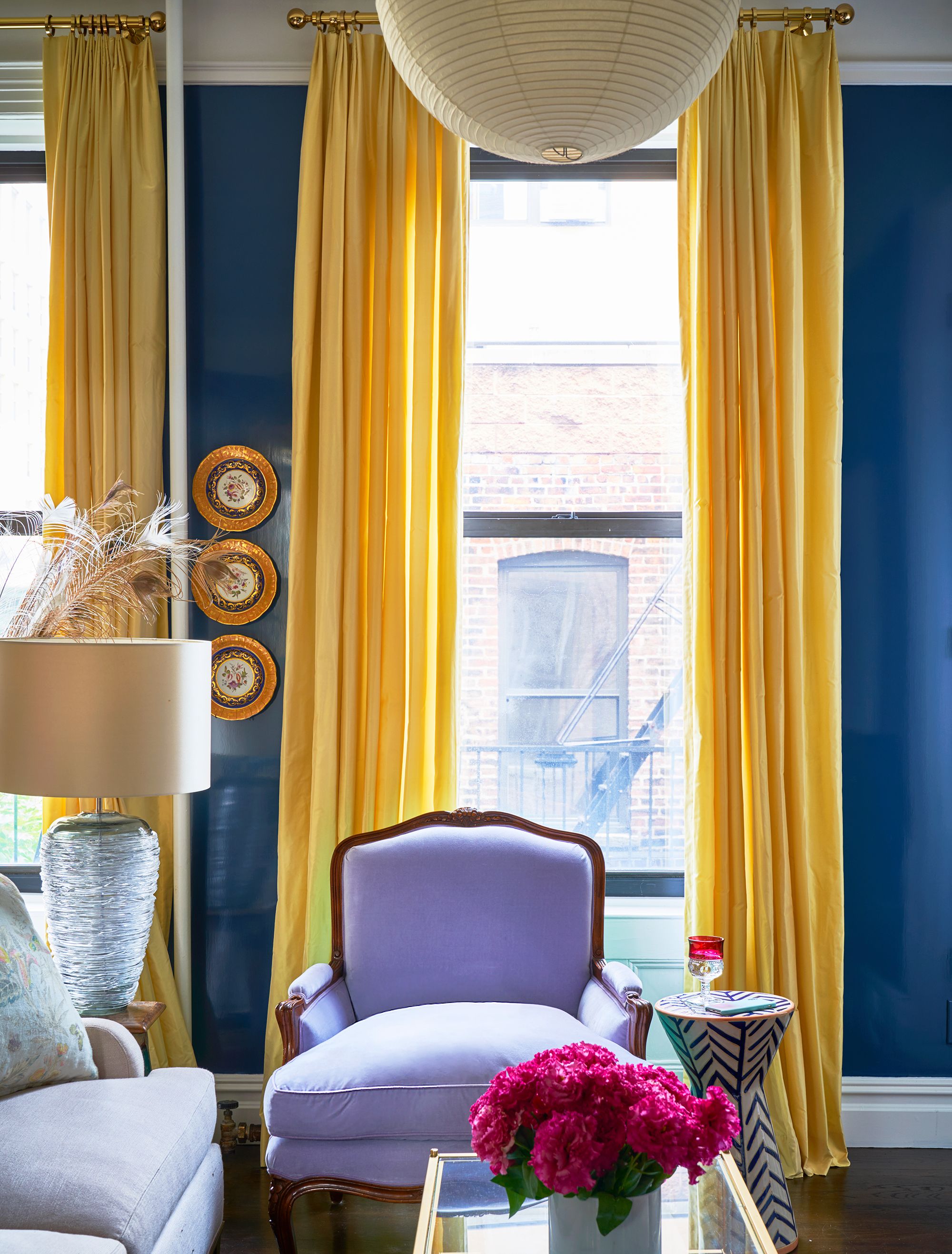 Royal blue paint wall with yellow curtains