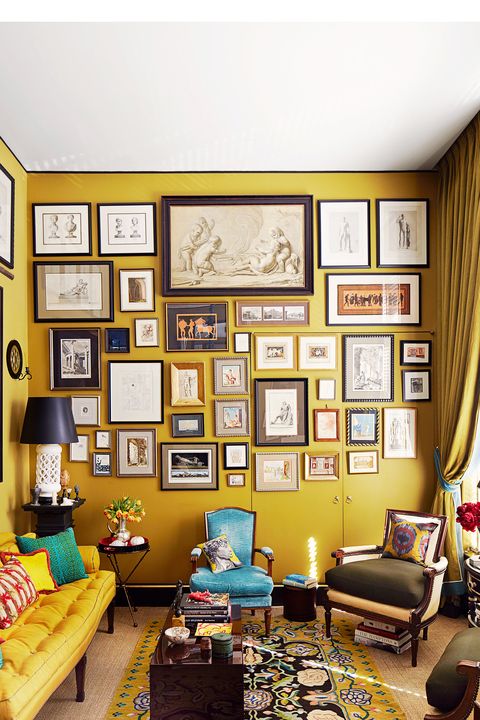 yellow living room with gallery wall