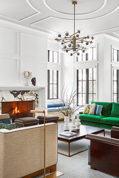 white modern formal living room with green sofa